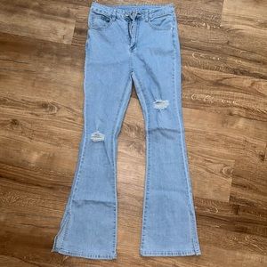 High waste flair jeans with a slit hem, size medium, never been worn